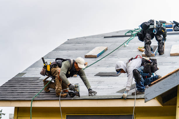 Professional Roofing technician working in Martell, CA